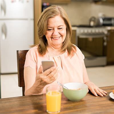 ILSI article on healthy aging _ Photo of older woman at breakfast table